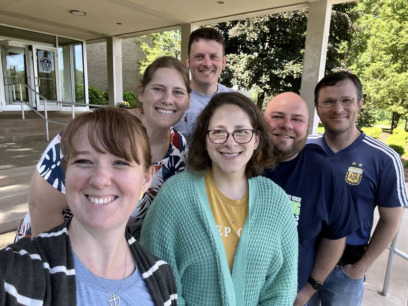 Members of the Brown Seminar together outdoors, standing outside a building